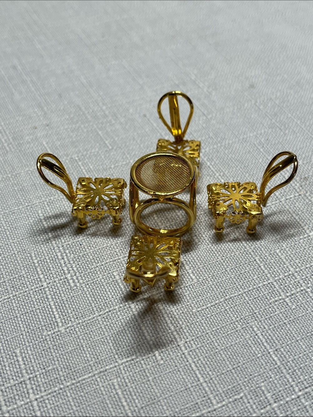 Minitiques dollhouse miniature set 
gold-plated mesh top table
four chairs